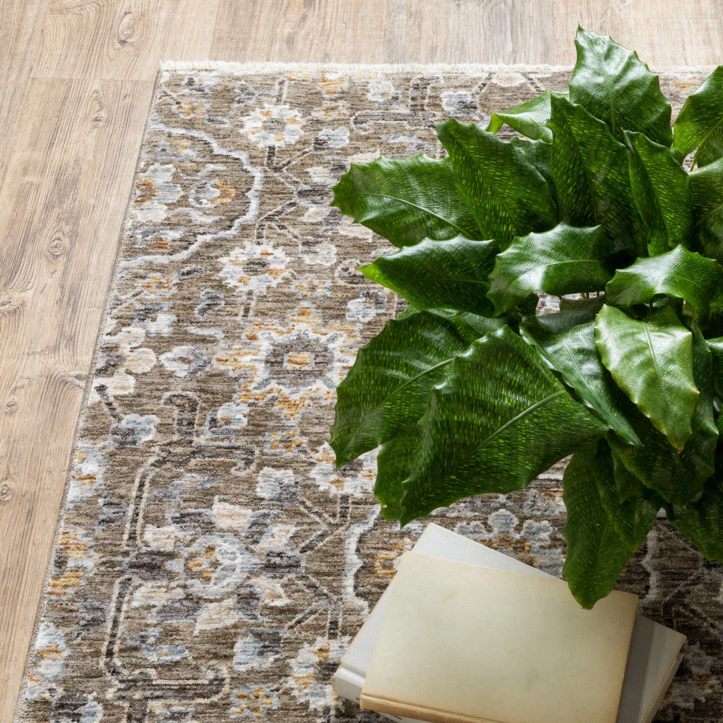 HomeRoots Floral Power Loom Stain Resistant Area Rug With Fringe