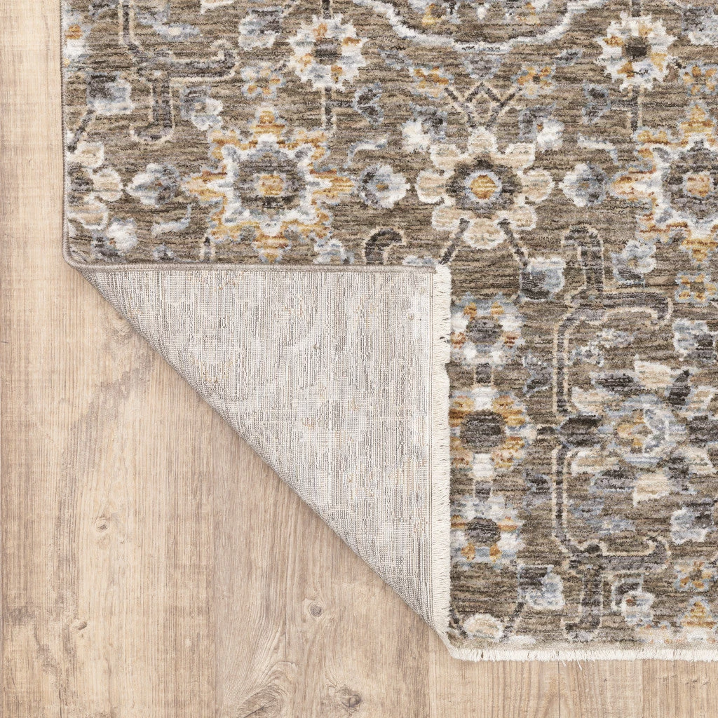 HomeRoots Floral Power Loom Stain Resistant Area Rug With Fringe